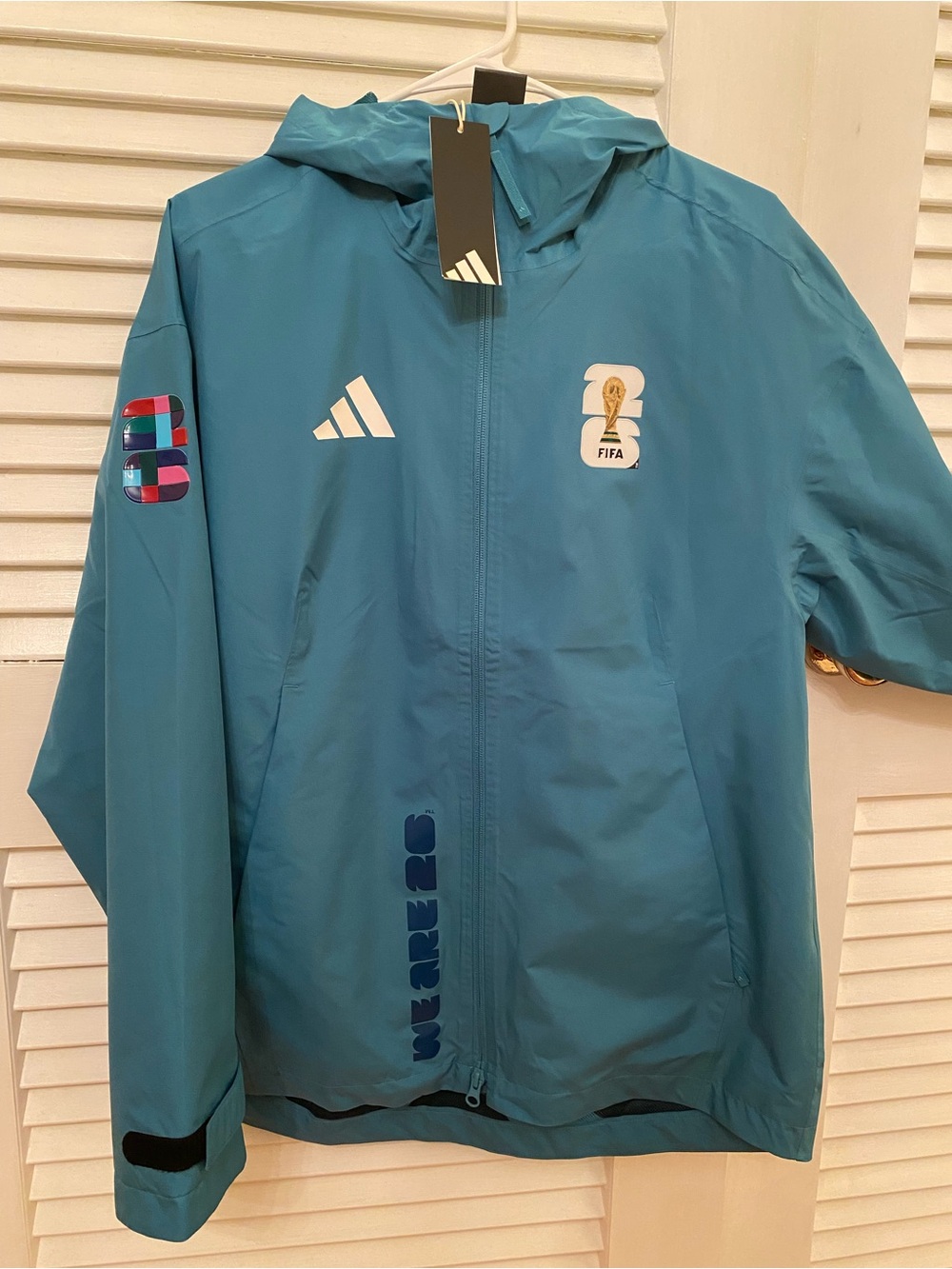 FIFA World Cup full-zip rain jacket from adidas in teal, with original tags